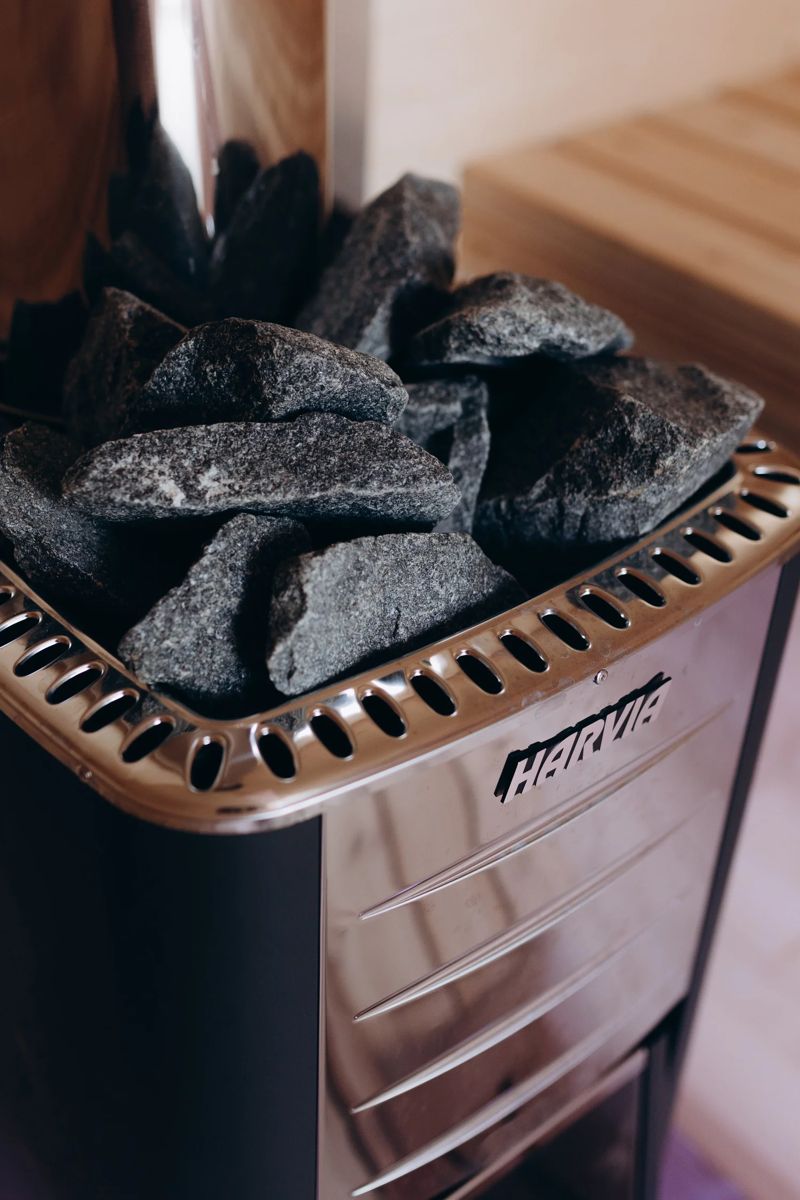 Hot sauna stones on a wood-fired sauna stove